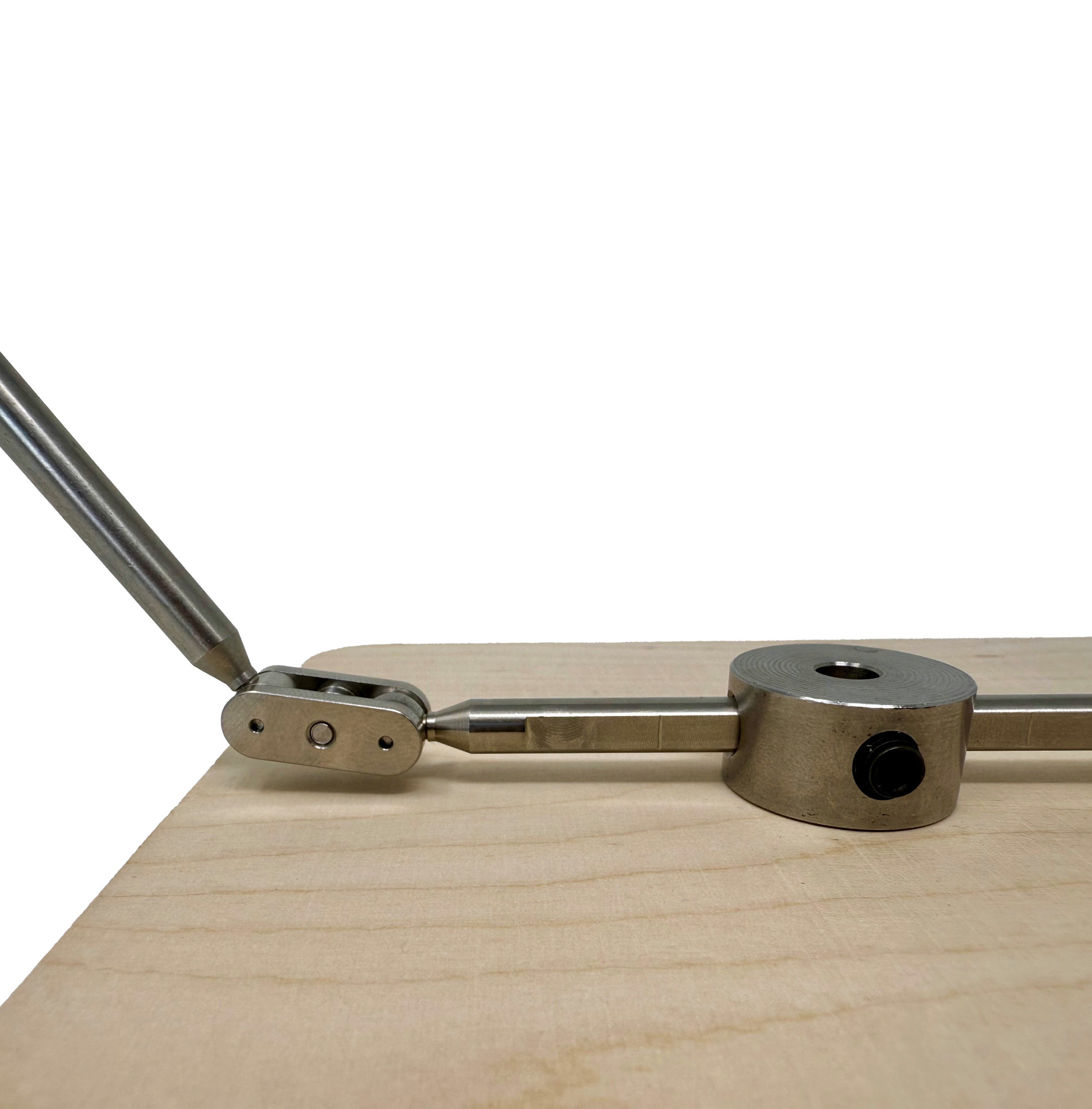 Stop motion animation rig with ball and socket joints, enabling suspended puppet poses for dynamic scene.