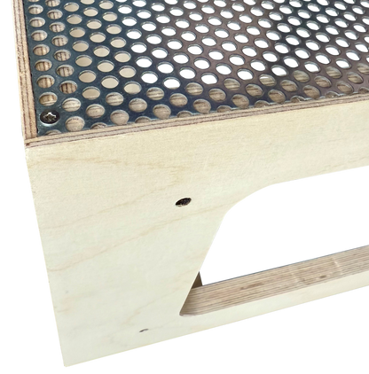 Close-up of Stop Motion Animation Stage, showing how the design encapsulates the sharp edges of the perforated steel.
